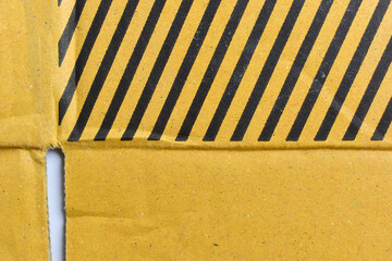 Wall Mural - striped black and yellow cardboard box texture background