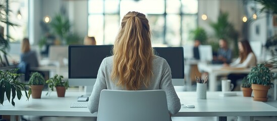 Sticker - Woman Working at a Desk in a Modern Office