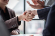 © David - Business handshake for teamwork of business merger and acquisition,successful negotiate,hand shake,two businessman shake hand with partner to celebration partnership and business deal concept