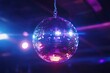 © Dzikrul Husnani - disco ball with mirror surface and bright rays, hanging on ceiling, night party background , ai