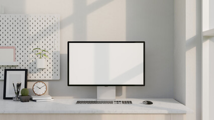 Wall Mural - A modern white computer desk features a computer with a white-screen mockup and decor.