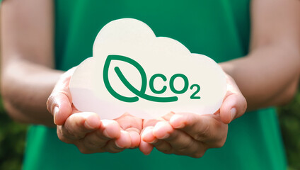 Hand holding with cloud for co2, ESG and net zero. energy saving concept. save our planet, world environment day, world earth day. sustainable development and green business.