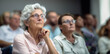© 18042011 - an adult woman in casual clothes and glasses at a lecture or seminar at a university.