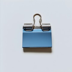 Elegant Blue Metal Binder Clip Lying Flat at the Center of a Plain Light Colored Background Minimal Still Life Scene for Office or Stationery Branding