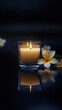 © Mr Muslich - A Lit Candle and Plumeria Flowers on a Reflective Surface