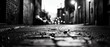 © ontsunan - A moody black and white alleyway scene showcasing cobblestone pavement and distant street lights at night.