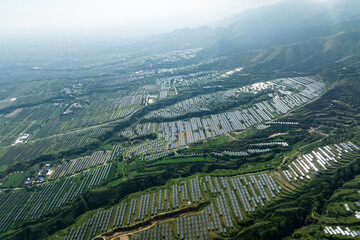 view of solar power station on green hill