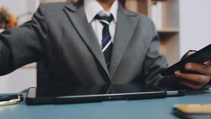 Wall Mural - Business woman hand holding credit card and use laptop and smartphone in office.