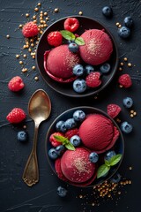 Wall Mural - Three plates showcase dark red ice cream garnished with blueberries and raspberries against a striking dark background