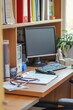 © Starlight - A doctor's desk with a stethoscope, medical books, and a computer. The desk is organized and professional, Generative AI