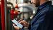 © Thanos - Plumber Conducting Plumbing System Diagnosis Through Smart Technology and Tablet