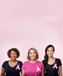 © Itxu - World Breast Cancer Awareness Day. Three women of different ages and races wear a pink ribbon on their t-shirts united in the fight against cancer.