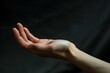 © Tanu - A hand extends forward, poised to make contact with an unseen object, symbolizing curiosity and exploration,. Slender fingers in a graceful, elongated shape, AI generated