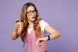 © ViDi Studio - Young successful employee business woman corporate lawyer wear classic suit vest white t-shirt glasses work in office use smart watch drink coffee hurry up isolated on plain pastel purple background.