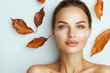 © StellaPattaya - Portrait of beautiful young woman with autumn leafs. Healthy clean fresh skin make up beauty cream eyes on white background , advertising banner of organic natural cosmetic products for facial