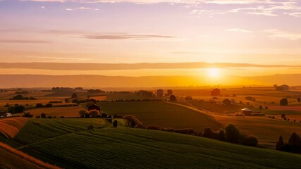 Wall Mural - Breathtaking sunset over serene fields in rural landscape during evening hours