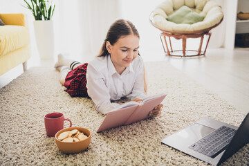 Poster - Full size photo of teen daughter lying floor write notebook snacks wear uniform remote education home schooling isolated indoors background