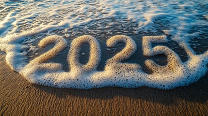 The year 2025 is written on sand on a beach, with the words Happy New Year and Merry Christmas above, and a calendar for the new year.