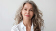 © Yuwarin - Portrait of beautiful happy middle aged woman looking at camera on white background