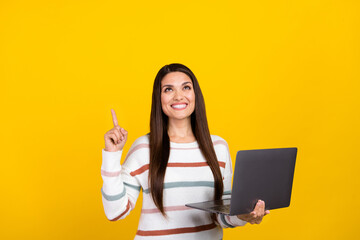 Canvas Print - Photo of mature brunette hair business woman pointing finger above head holding computer work call isolated on yellow color background