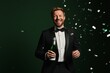 © Maxim Borbut - The man is holding a bottle of champagne and celebrating New Year's Eve with confetti, a party in the background, dressed in a tuxedo, celebrating a new year, a wedding, a birthday, an event for