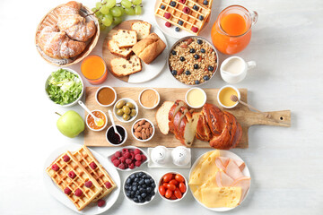 Poster - Different meals served for breakfast on white table, flat lay