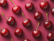 © SerPak - Fresh red cherries with water droplets are arranged on a vibrant pink background in a visually appealing manner exuding freshness, juiciness, and a feeling of irresistible delight.