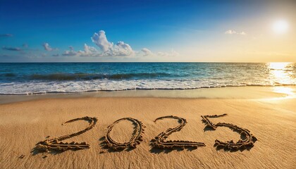 Wall Mural - 2025 year written on sandy beach sea at sunny day