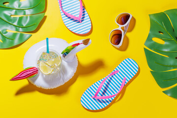 Poster - A vibrant summer vacation scene with flip flops, shades, and a floating flamingo