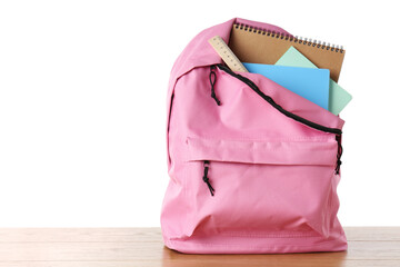 Poster - Backpack with notebooks and ruler on wooden table against white background, space for text