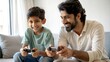 © N7 - Father and Son Bonding Time - Indian father and son sharing a joyful moment while playing a game.