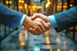 © Worrapol - Sealing the Deal Under Golden Lights: A firm handshake between business partners against a bokeh backdrop of city lights speaks of agreements and collaborations forged.