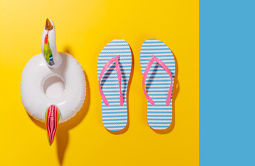 Poster - A vibrant summer vacation scene with flip flops and a floating flamingo