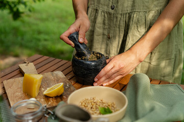 Making Fresh Pesto: Blending Basil, Pine Nuts, Garlic, Parmesan, and Olive Oil