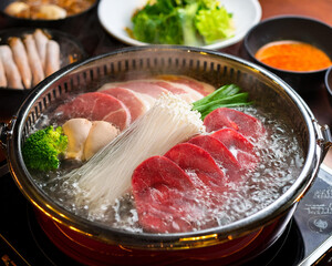 Wall Mural - shabu-shabu in hotpot. a Japanese nabemono hotpot dish. favorite restaurant menu. hot soupy dishes.