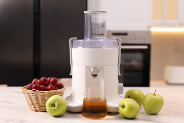 Canvas Print - Modern juicer, fresh fruits and glass on white marble table in kitchen