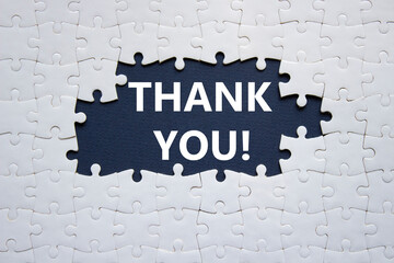 Wall Mural - Thank you symbol. White puzzle with words Thank you. Beautiful deep blue background. Business and Thank you concept. Copy space.