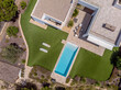 © ADDICTIVE STOCK - Modern luxury home with pool from aerial view