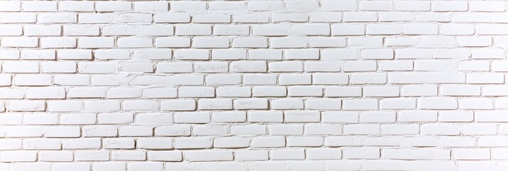 Wall Mural - A textured white brick wall with a uniform pattern, suitable for backgrounds and design.