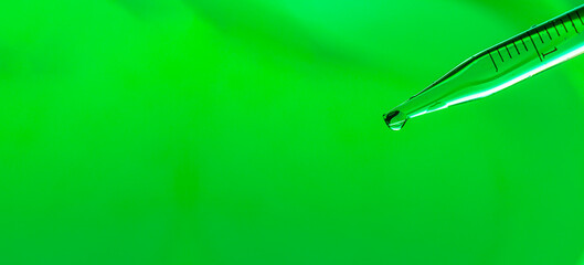 Wall Mural - close-up science experiment green background,macro green science experiment background,lab glassware