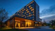 © Ishika - A modern hotel building with a large glass facade