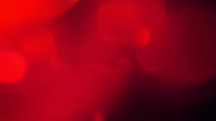 red abstract light flow with soft bokeh effect on black background