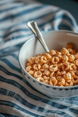 Wall Mural - A simple breakfast scene with a bowl of cereal and a spoon