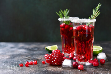 Cranberry cocktail with pomegranate and rosemary.