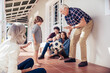 © Marko Geber - Multigenerational family playing soccer on house porch