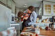 © Geber86 - Father and son playing and laughing in kitchen during breakfast