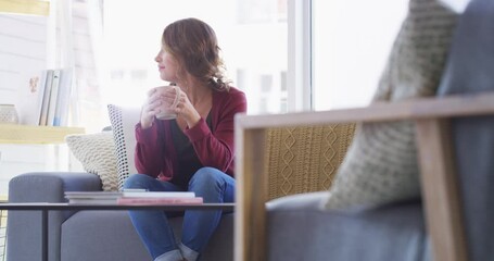 Poster - Relax, home coffee cup and happy woman drinking hot chocolate, warm coco or morning wellness beverage. Happiness, cappuccino and person with latte, espresso or matcha green tea mug on lounge sofa