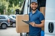 © YURIMA - A friendly delivery driver with a beard and cap is seen in a parking lot next to a delivery van, holding cardboard boxes and a clipboard. He is ready to deliver packages to customers