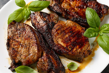 Wall Mural - Grilled Pork Loin steaks in a white plate