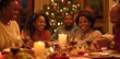 © YURIMA - Gathering around a festive Christmas dinner with family, enjoying the warmth of togetherness, laughter, and cheerful decorations of candles and lights. Its a time for bonding and celebration